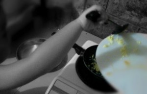 Saute garlic in olive oil, over medium heat. The garlic got burned a little since he had trouble moving the turner.